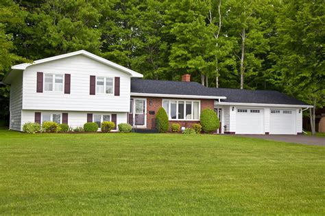 split level house with metal roof|2 story split level house.